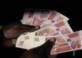 Currency Turmoil Returns in Zimbabwe With Local Dollar Plunging 40% on Black Market